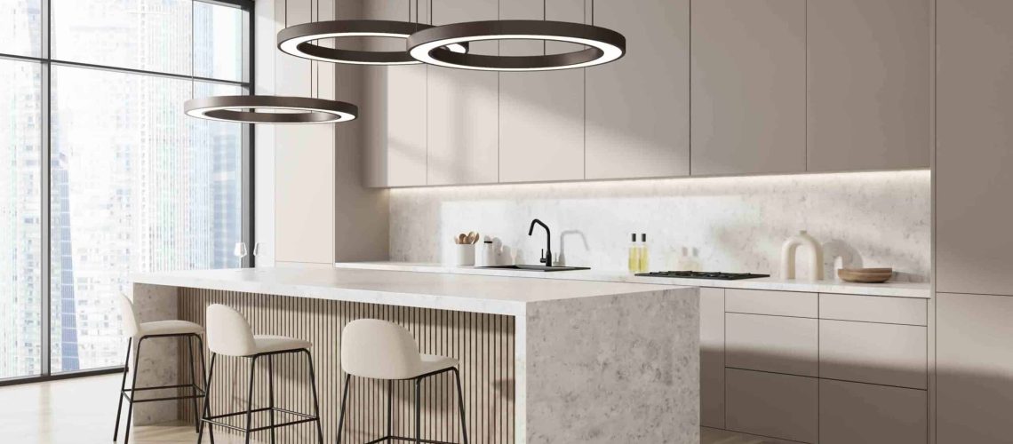 Open-concept kitchens are becoming increasingly popular in modern homes. An open-concept kitchen is one that has no walls or barriers separating it from the rest of the house., Beige Kitchen Interior With Bar Chairs And Island, Side View, Ha